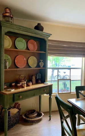 a kitchen with stainless steel appliances kitchen island granite countertop a refrigerator a stove and a sink