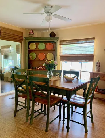 a living room with furniture and painting on the wall