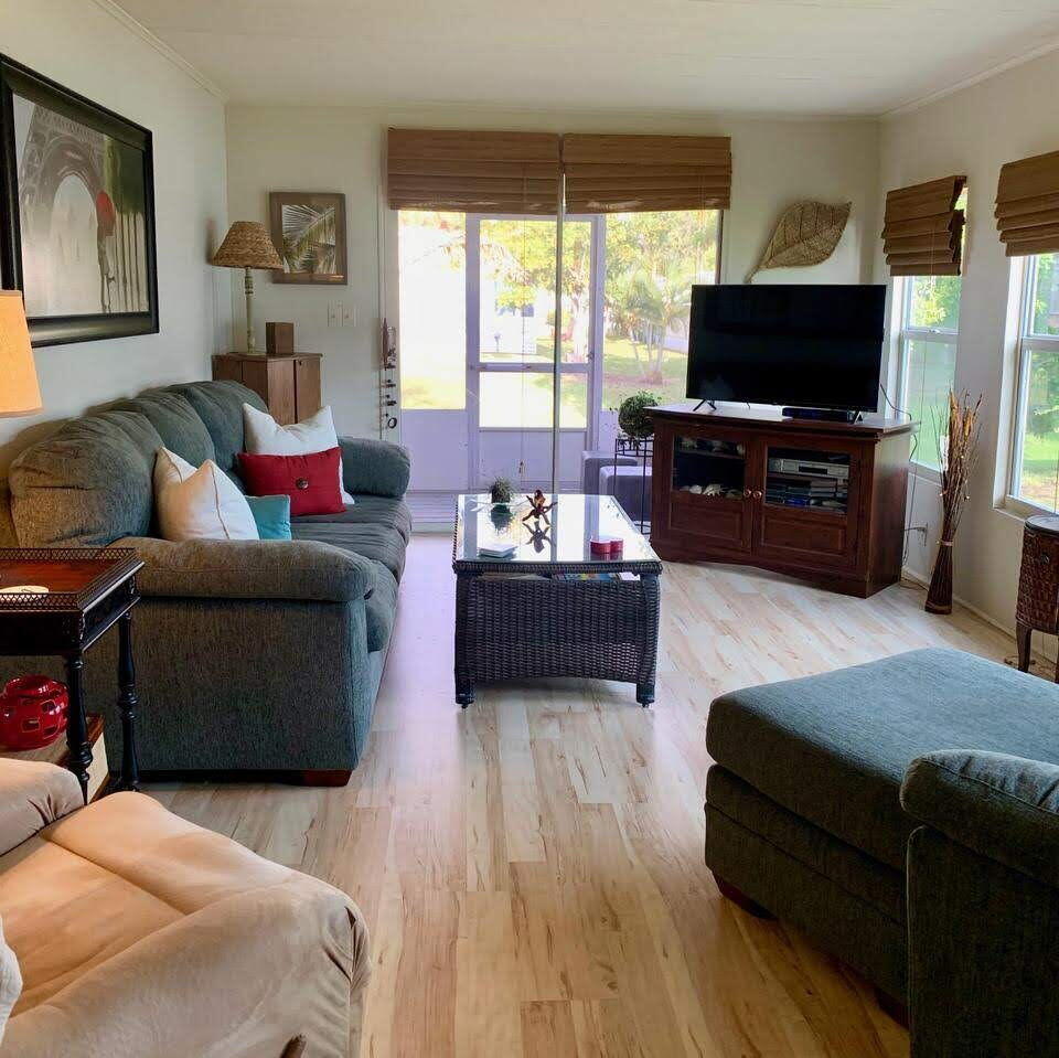 12 Orinco Road Fort Pierce, FL 34952 - Photo 22 of 50 a living room with furniture and a flat screen tv