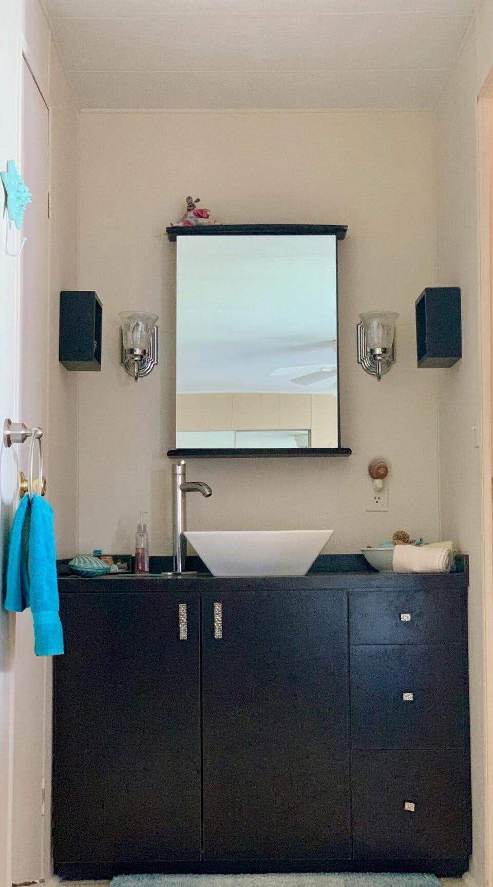 12 Orinco Road Fort Pierce, FL 34952 - Photo 25 of 50 a bathroom with a sink a mirror and a window