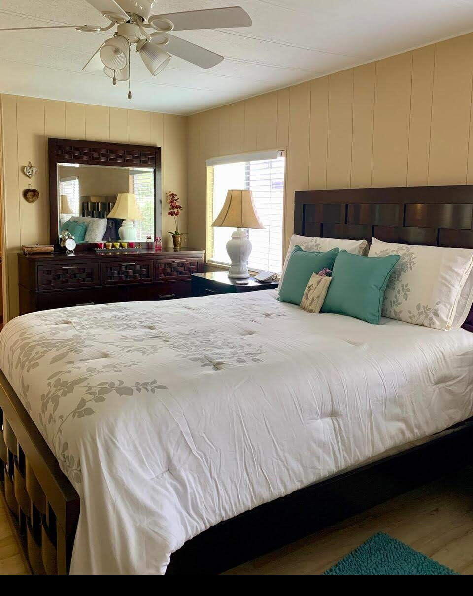 12 Orinco Road Fort Pierce, FL 34952 - Photo 30 of 50 a large bedroom with a bed and window