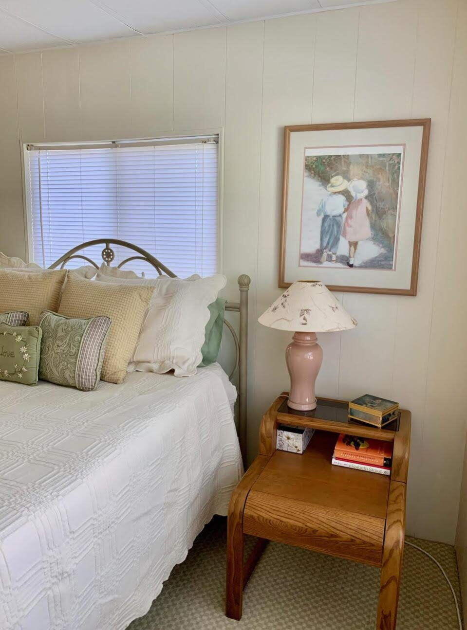 12 Orinco Road Fort Pierce, FL 34952 - Photo 38 of 50 a bedroom with a bed and a potted plant on dresser