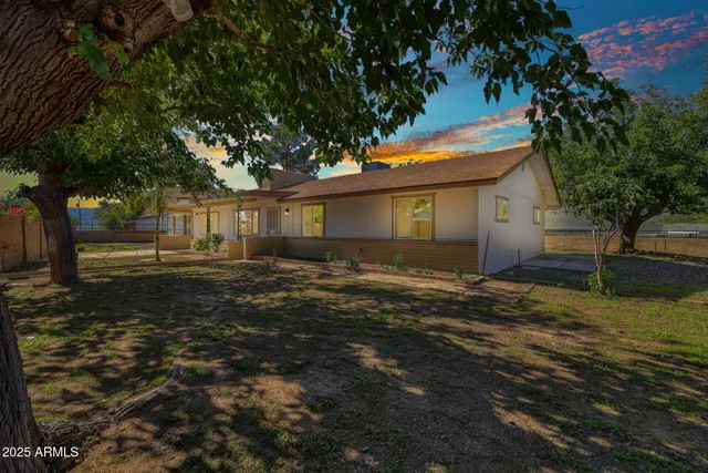 a backyard of a house with lots of green space