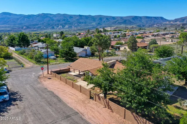an aerial view of a house with outdoor space