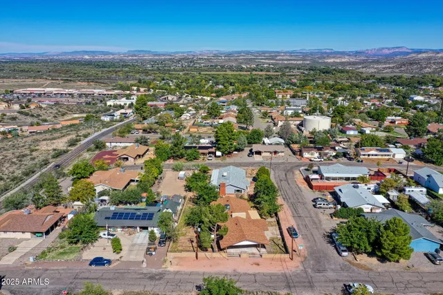 an aerial view of residential house and sandy dunes