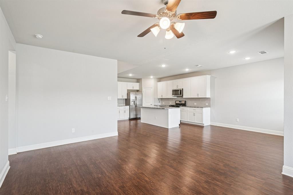 2321 Mount Olive Lane Forney, TX 75126 - Photo 11 of 35 Unfurnished living room featuring recessed lighting, dark wood-style flooring, and a ceiling fan