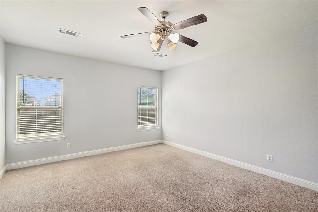 2321 Mount Olive Lane Forney, TX 75126 - Photo 17 of 35 Spare room with light carpet and a ceiling fan