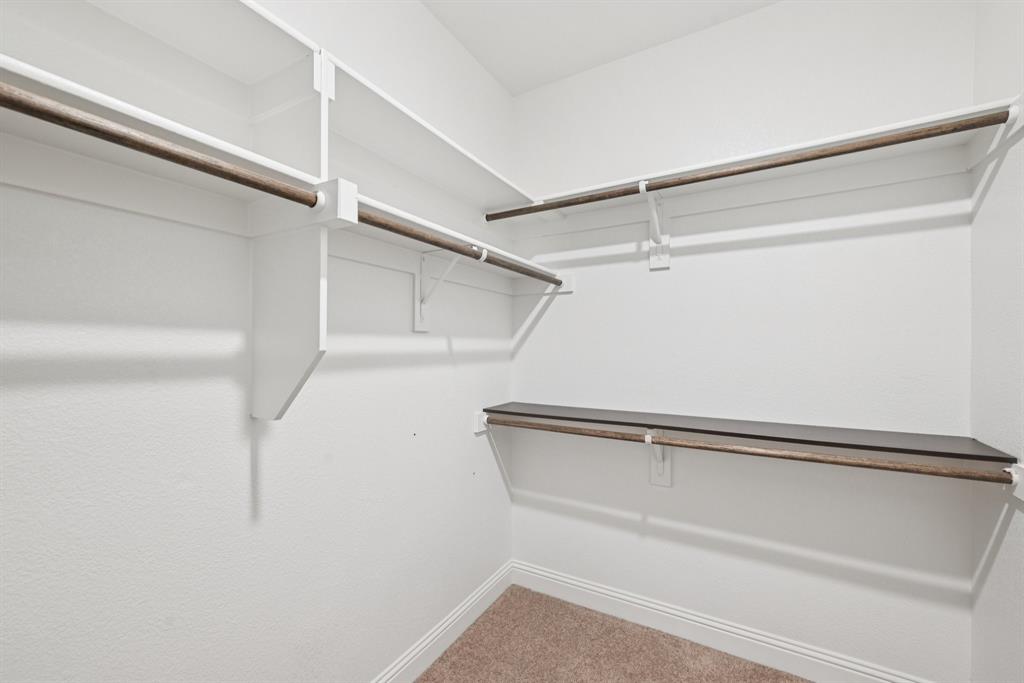2321 Mount Olive Lane Forney, TX 75126 - Photo 21 of 35 Walk in closet with carpet floors