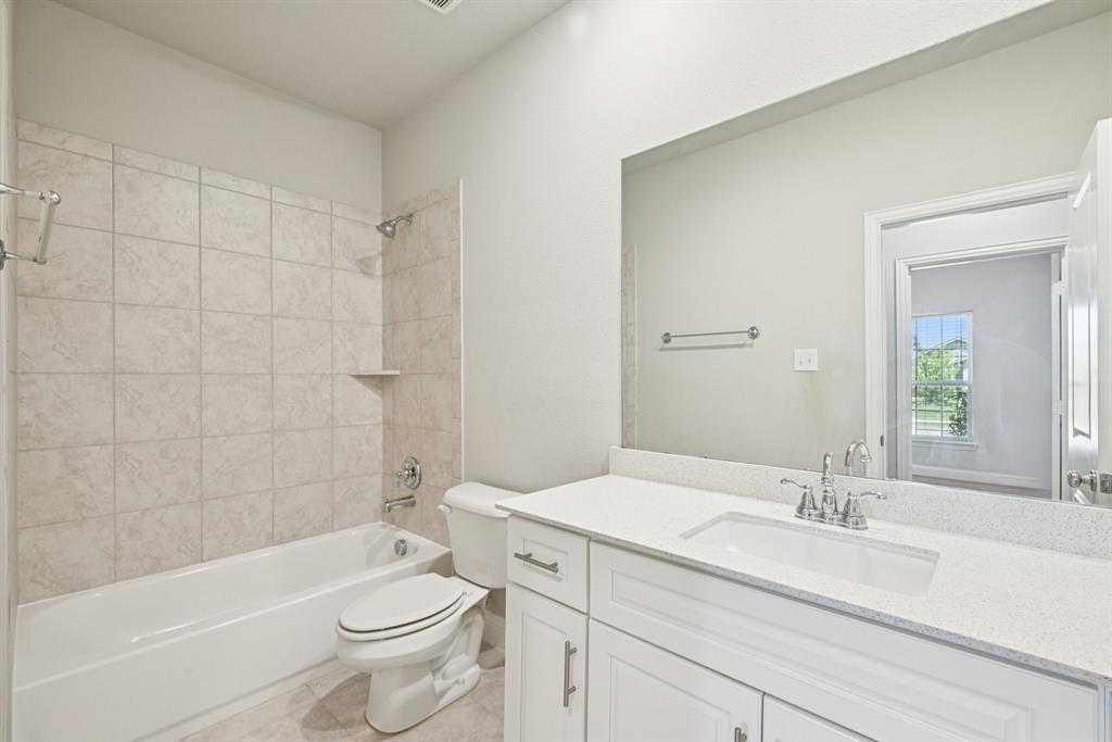 2321 Mount Olive Lane Forney, TX 75126 - Photo 24 of 35 Downstairs Full bath featuring vanity, shower / bath combination, and tile patterned floors