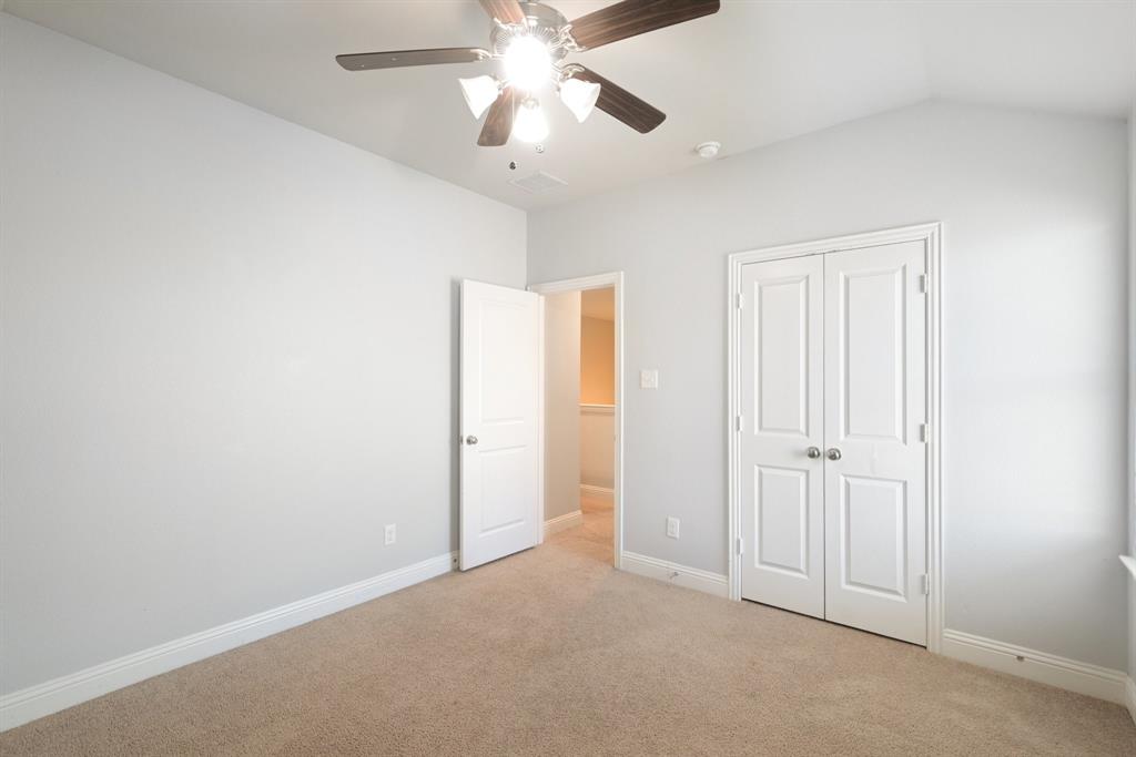 2321 Mount Olive Lane Forney, TX 75126 - Photo 25 of 35 Unfurnished bedroom featuring light colored carpet, a closet, and ceiling fan