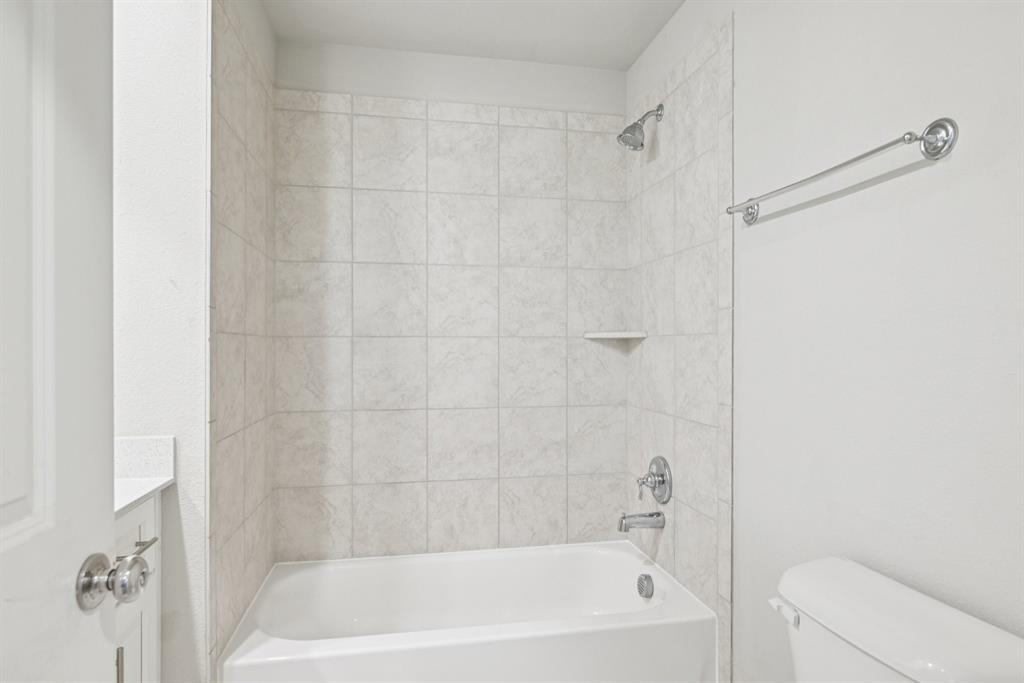 2321 Mount Olive Lane Forney, TX 75126 - Photo 27 of 35 Upstairs Full Bathroom featuring shower / tub combination and vanity