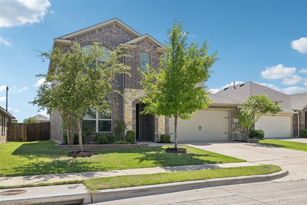 2321 Mount Olive Lane Forney, TX 75126 - Photo 3 of 35 French provincial home with brick siding, driveway, an attached garage, and stone siding