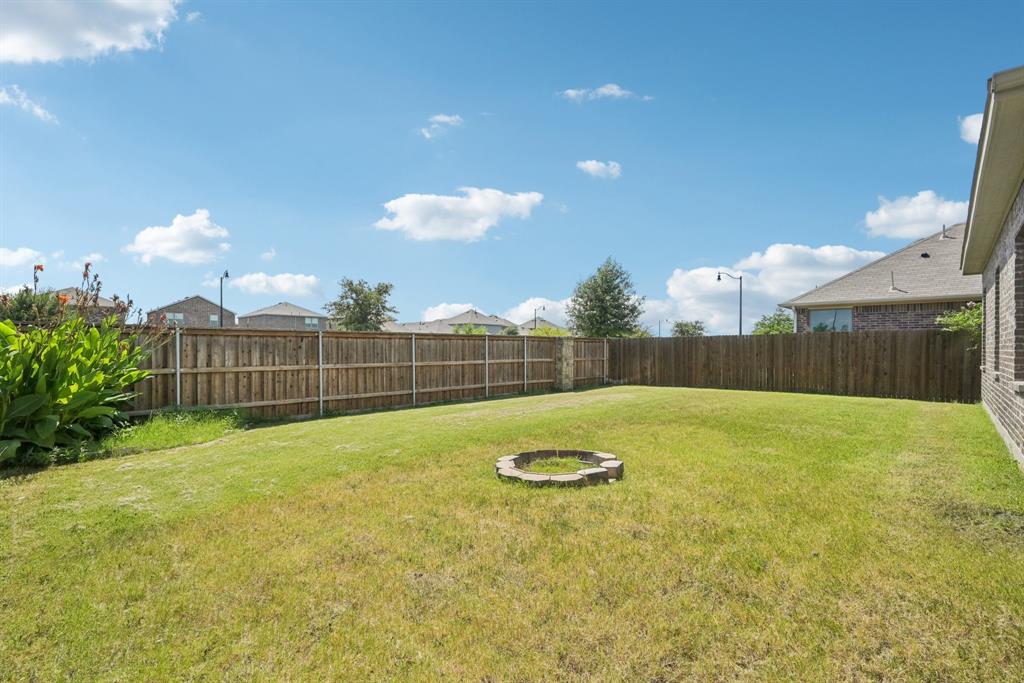 2321 Mount Olive Lane Forney, TX 75126 - Photo 33 of 35 Fenced backyard featuring a fire pit