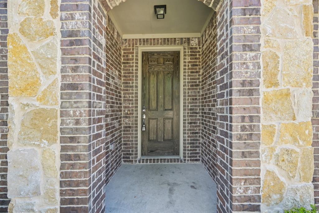 2321 Mount Olive Lane Forney, TX 75126 - Photo 4 of 35 View of exterior entry with brick siding