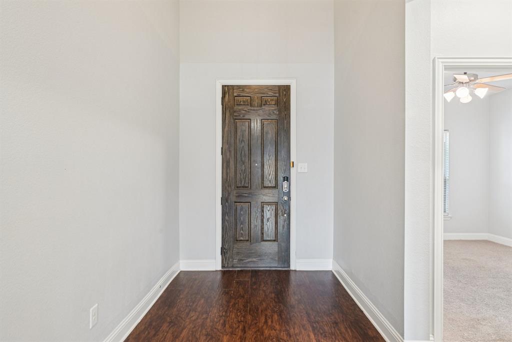 2321 Mount Olive Lane Forney, TX 75126 - Photo 5 of 35 Entryway featuring wood finished floors and a ceiling fan