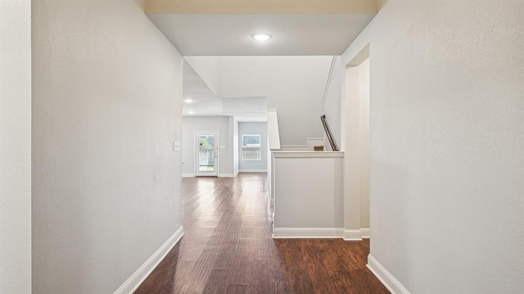 2321 Mount Olive Lane Forney, TX 75126 - Photo 6 of 35 Corridor with wood finished floors, a textured wall, and recessed lighting
