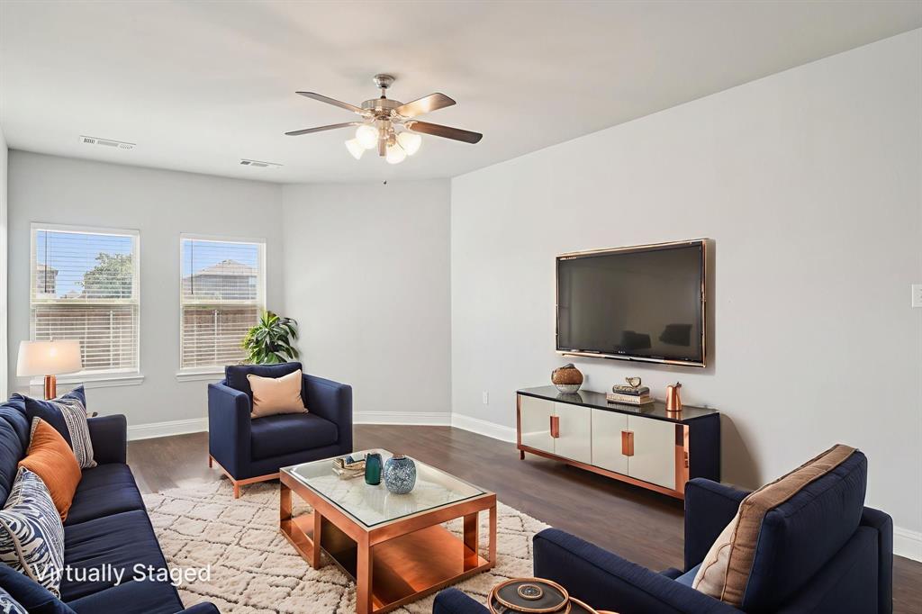 2321 Mount Olive Lane Forney, TX 75126 - Photo 7 of 35 Living room featuring wood finished floors and a ceiling fan