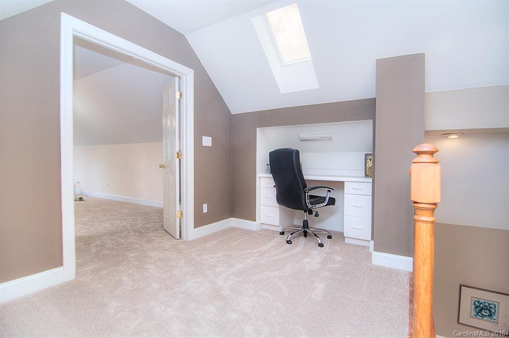 29023 Beaver Run Tega Cay, SC 29708 - Photo 18 of 24 a view of a workspace with furniture and a window