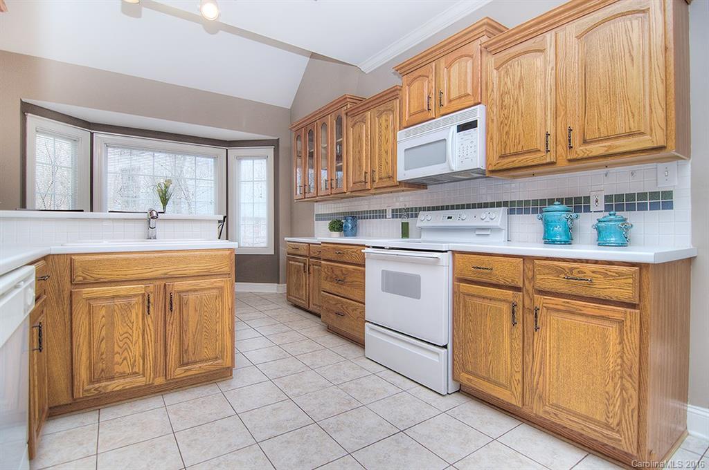 29023 Beaver Run Tega Cay, SC 29708 - Photo 7 of 24 a kitchen with cabinets appliances and a sink