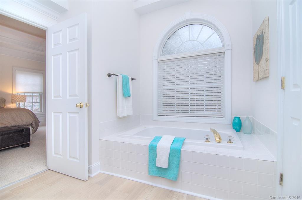 29023 Beaver Run Tega Cay, SC 29708 - Photo 10 of 24 a view of bathroom with bathtub and shower