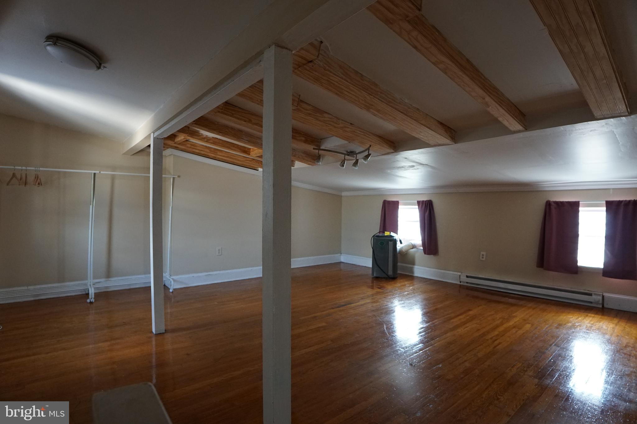 802 Cathedral Street, Unit 4 Baltimore, MD 21201 - Photo 12 of 15 a view of empty room with wooden floor