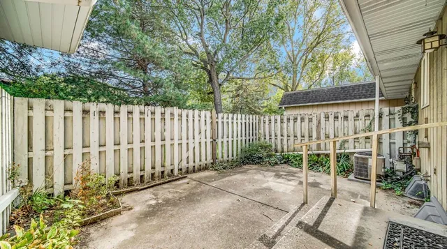 a garden view with iron fence