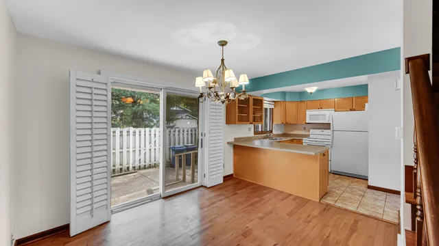 a kitchen with stainless steel appliances granite countertop a stove and a refrigerator