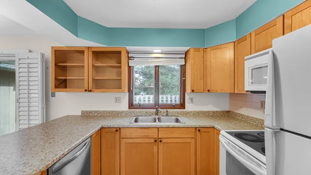 a kitchen with a sink and a window