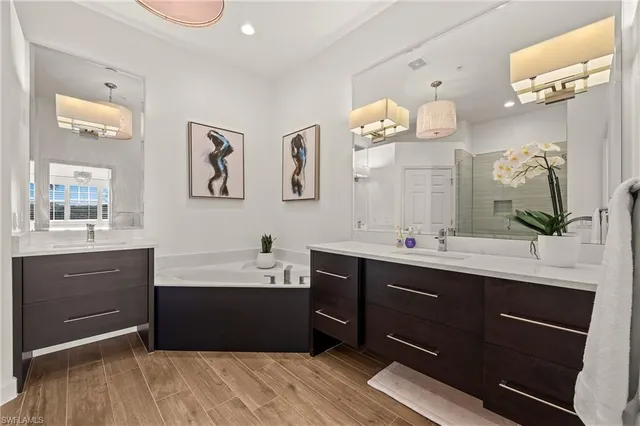 a bathroom with a sink vanity and a mirror