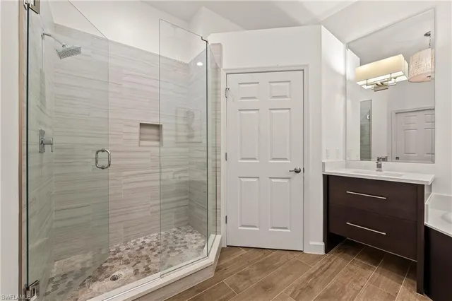a bathroom with a shower and a sink