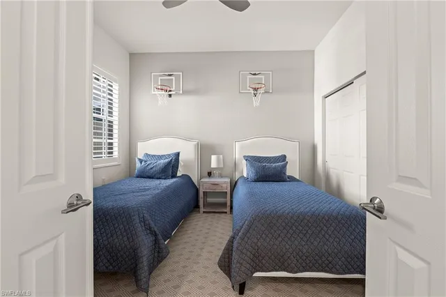 a bedroom with a bed and window