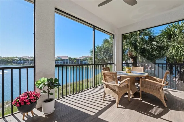 a view of a balcony with furniture