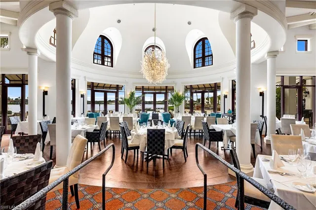 a view of a big dining room with lots of furniture and chandelier