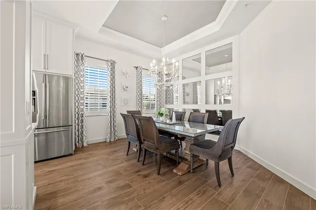 a view of a dining room with furniture and a window