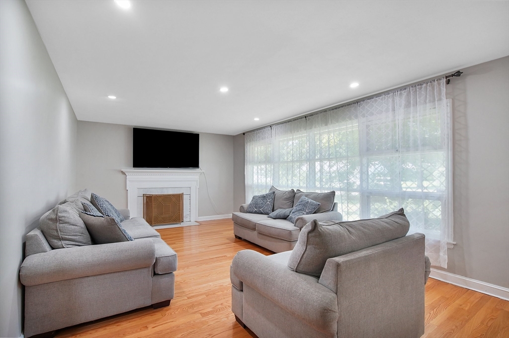 67 Jeffrey Road Springfield, MA 01119 - Photo 8 of 28 a living room with furniture a flat screen tv and a large window