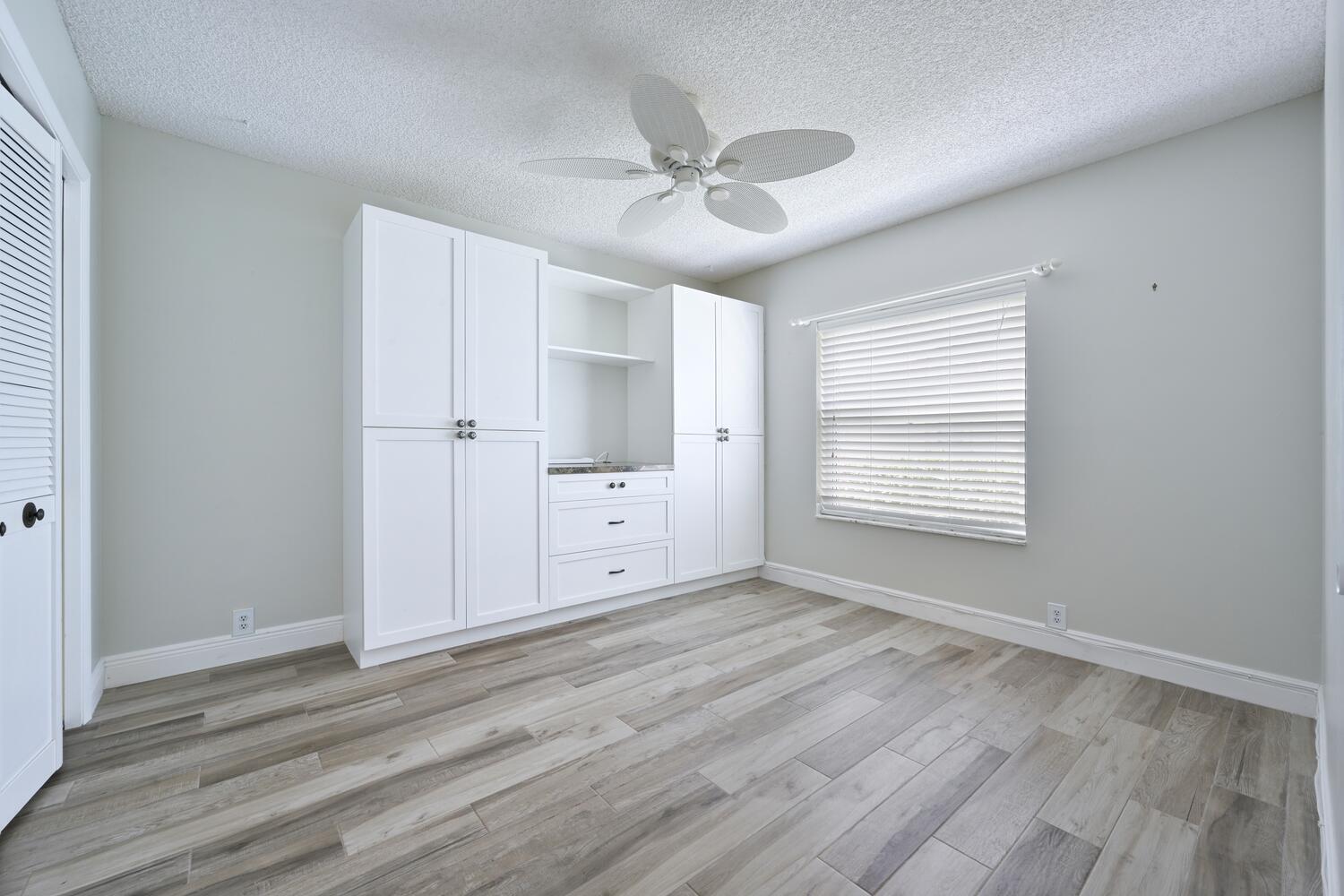 166 Bayberry Circle Jupiter, FL 33458 - Photo 21 of 37 a view of an empty room with a window
