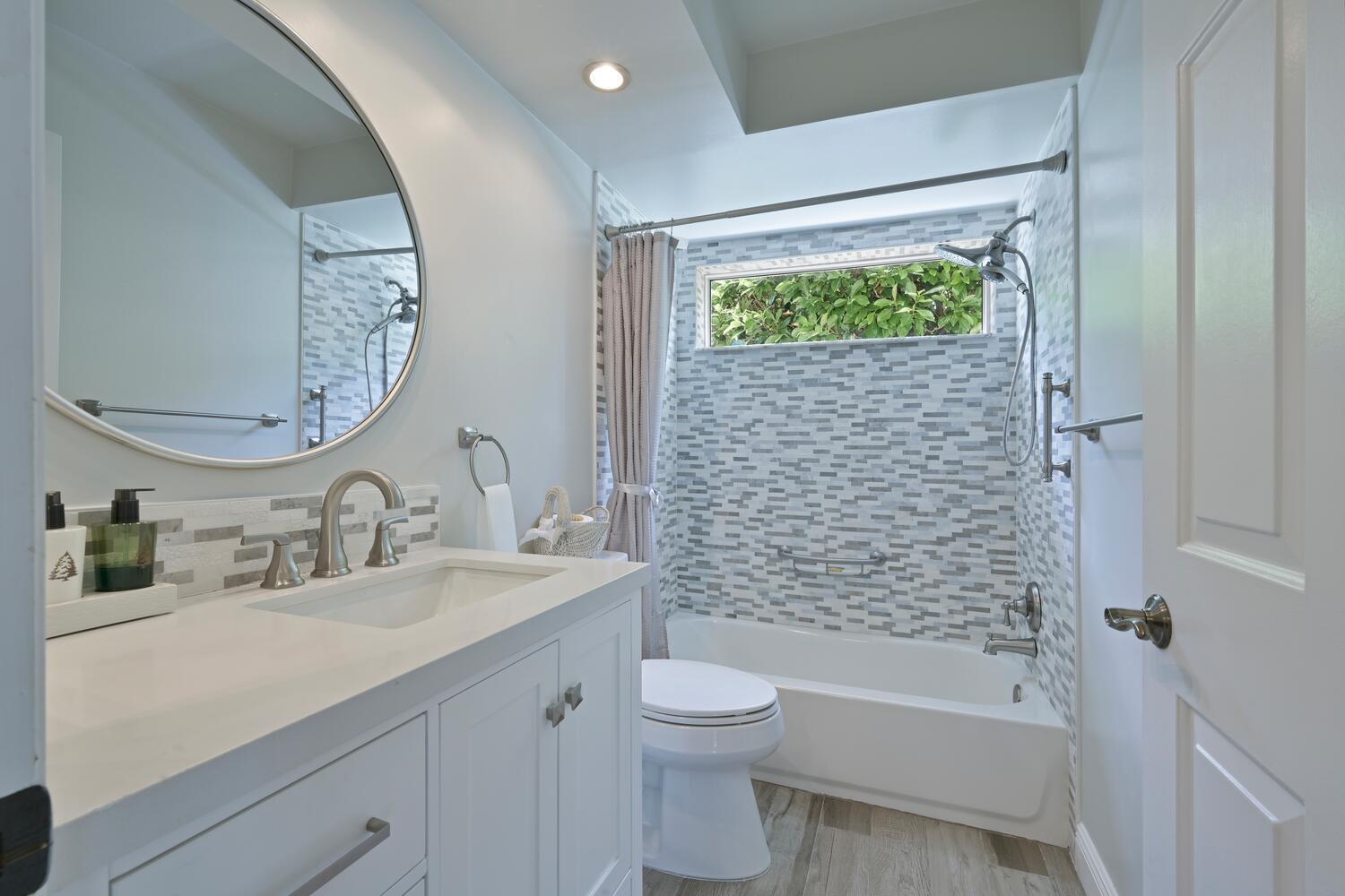 166 Bayberry Circle Jupiter, FL 33458 - Photo 22 of 37 a bathroom with a granite countertop sink a toilet and shower