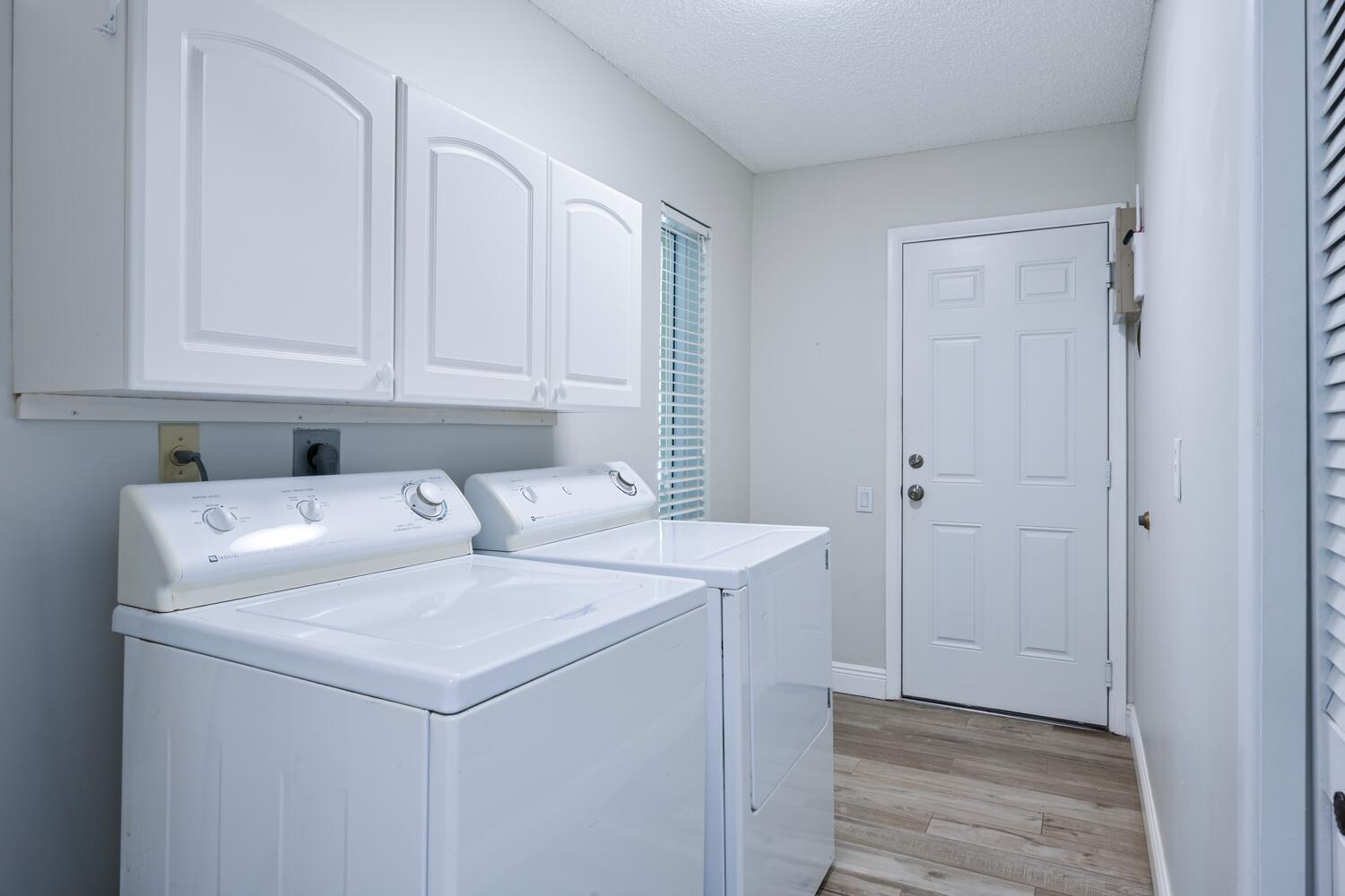 166 Bayberry Circle Jupiter, FL 33458 - Photo 24 of 37 a utility room with dryer and washer