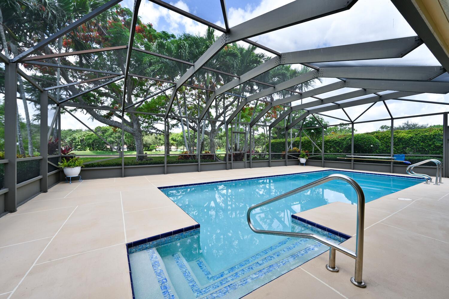 166 Bayberry Circle Jupiter, FL 33458 - Photo 25 of 37 a view of a swimming pool with a patio