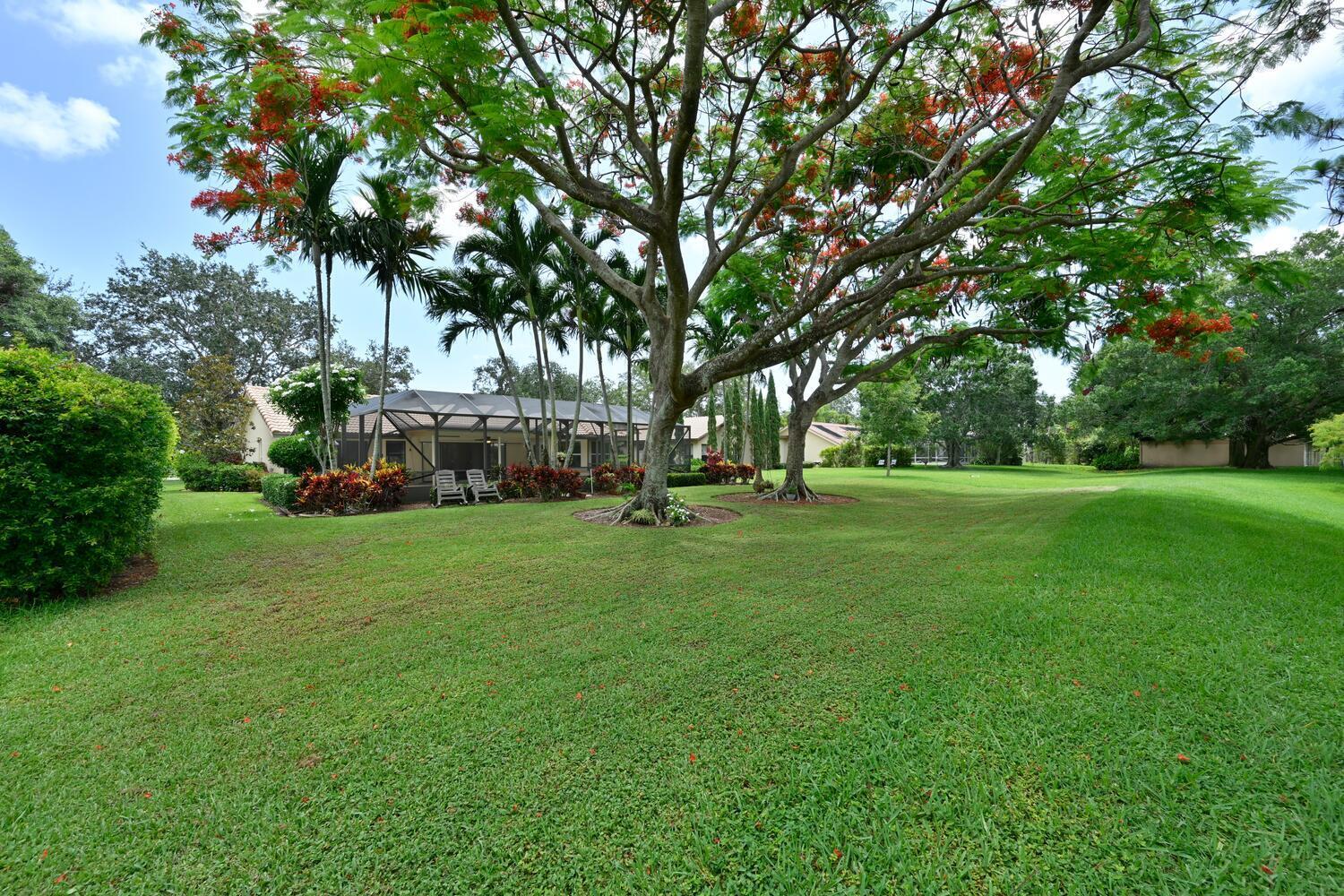 166 Bayberry Circle Jupiter, FL 33458 - Photo 7 of 37 a view of a park with large trees