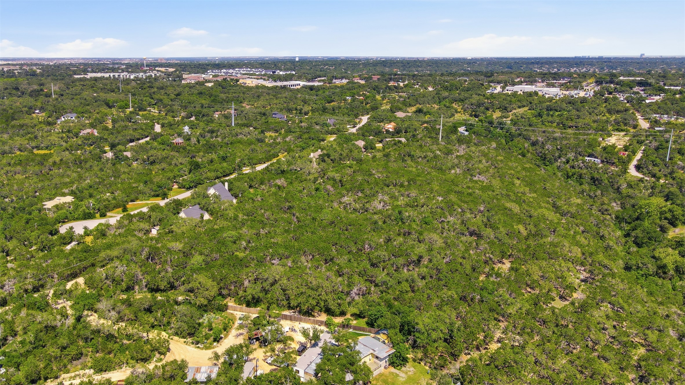 0 North Ranch Road 620 Road Austin, TX 78726 - Photo 7 of 20 a view of a city with lush green forest