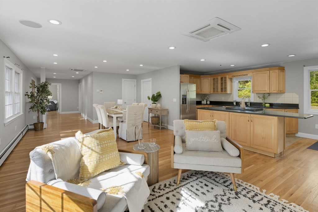 5 Charles Street Georgetown, MA 01833 - Photo 12 of 36 a living room with stainless steel appliances furniture cabinets and a wooden floor