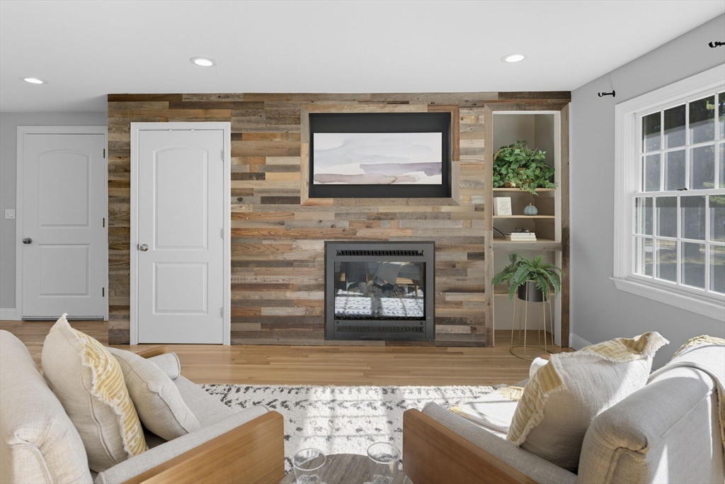 5 Charles Street Georgetown, MA 01833 - Photo 22 of 36 a living room with furniture and a fireplace