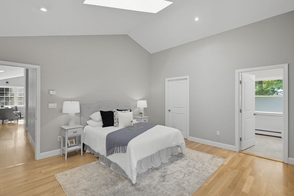 5 Charles Street Georgetown, MA 01833 - Photo 24 of 36 a bedroom with a bed and wooden floor