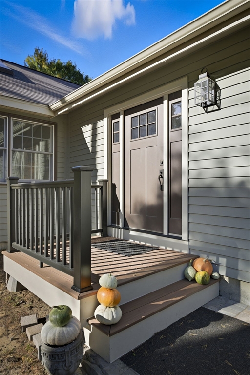 5 Charles Street Georgetown, MA 01833 - Photo 3 of 36 a view of a chair and tables in the balcony