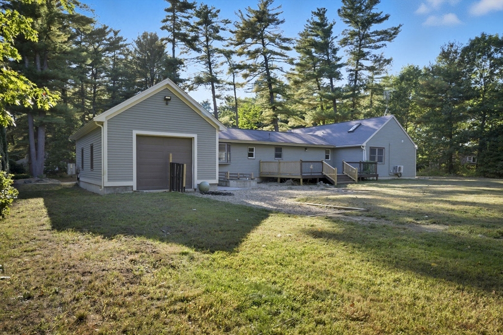 5 Charles Street Georgetown, MA 01833 - Photo 32 of 36 a front view of a house with a yard