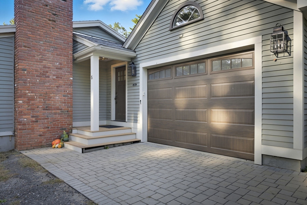 5 Charles Street Georgetown, MA 01833 - Photo 4 of 36 a view of a wooden door of the house