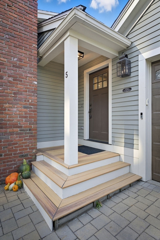 5 Charles Street Georgetown, MA 01833 - Photo 5 of 36 a front view of a house with entryway