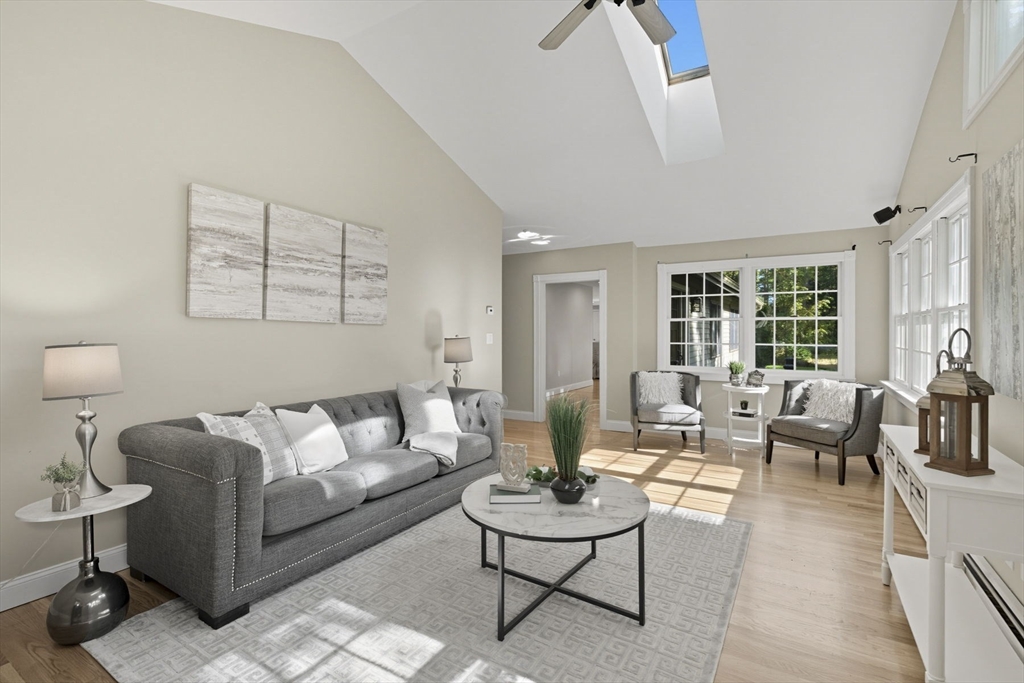 5 Charles Street Georgetown, MA 01833 - Photo 8 of 36 a living room with furniture and a large window