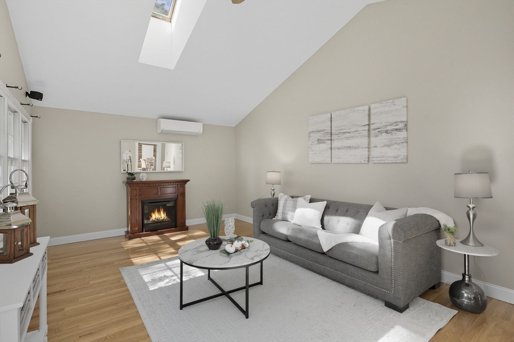 5 Charles Street Georgetown, MA 01833 - Photo 10 of 36 a living room with furniture and a fireplace